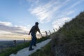 Man hiking Te Mata Peak track. Climbing steep uphill, HawkeÃ¢â¬â¢s Bay